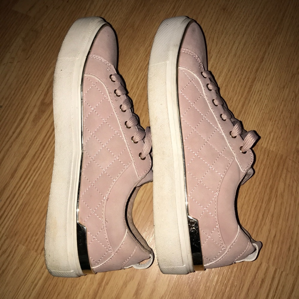 Pink sneakers with gold accent